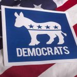 Elizabeth Warren Turns on Democrats Democrats logo on American flag background
