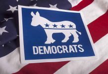 Elizabeth Warren Turns on Democrats Democrats logo on American flag background