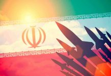 Iran Throws Out Nuclear Rules Silhouettes of missiles over Irans flag graphic.