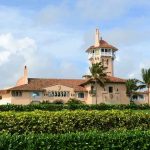 Socialist Mayor’s Luxury Hypocrisy Large pink mansion with tower, palm trees, and garden.