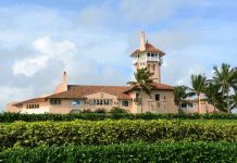 Socialist Mayor’s Luxury Hypocrisy Large pink mansion with tower, palm trees, and garden.