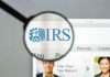 Magnifying glass over IRS website.