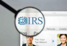 Magnifying glass over IRS website.