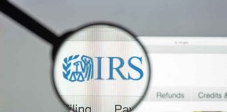 OnlyFans Earnings in Crosshairs Magnifying glass over IRS website.