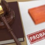 Why Public Safety Is Crumbling A gavel and a stamped document marked 'PROBATION'