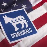 Democrats CRACK Down On Election Betting Democratic Party symbol on American flag background.