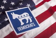 Democrats CRACK Down On Election Betting Democratic Party symbol on American flag background.