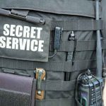 Secret Service Trainee ARRESTED — Spy Camera Horror Secret Service vest with various tactical gear attached.