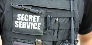 Secret Service Trainee ARRESTED — Spy Camera Horror Secret Service vest with various tactical gear attached.
