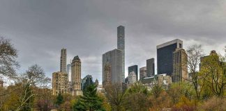 Population Control Won’t Save Us by 2050 People relaxing in a park, city skyline background.