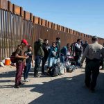 CIA Cartel Kill Plot? Unbelievable Allegations! Border patrol agents interact with a group of people.