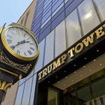 Clock in front of Trump Tower building entrance.