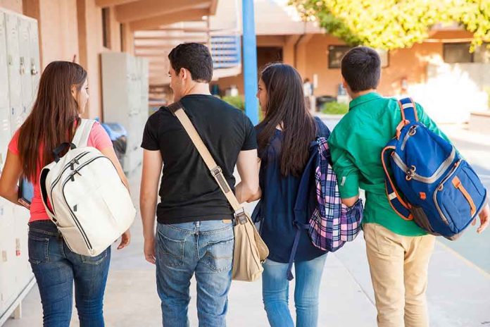 shutterstock_200190815 Group of students walking together in a school corridor