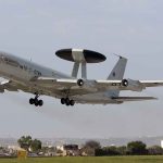 NATO AWACS aircraft taking off from an airfield