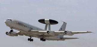Secret Greenland Talks: U.S. Military Expansion? NATO AWACS aircraft taking off from an airfield