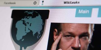 Outrage as Politician Mocks WAR HERO Online WikiLeaks website interface featuring a globe and a portrait of a man