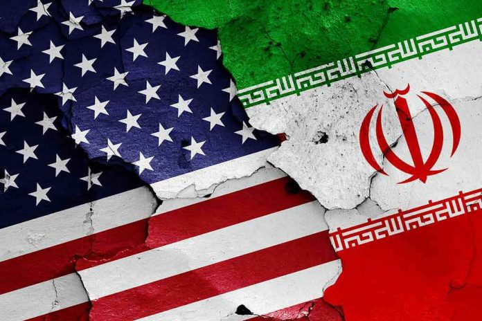 1152300314 Cracked American and Iranian flags on a wall.