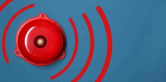 Pentagon BOMBSHELL — Ally Tagged ‘CRITICAL’ Spy Risk Red alarm bell on a blue background.
