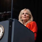 NBC Cornered Jill Biden — Her SHOCKING Reaction! Person speaking at podium with Vice President seal.