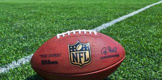 NFL Star Dead — TROUBLING History — Answers Go Missing NFL football on a green field.