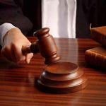 High Court BRUTALLY SLAPS DA — It’s About TIME! Judges gavel on desk with books.