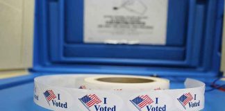 Roll of I Voted stickers on table.