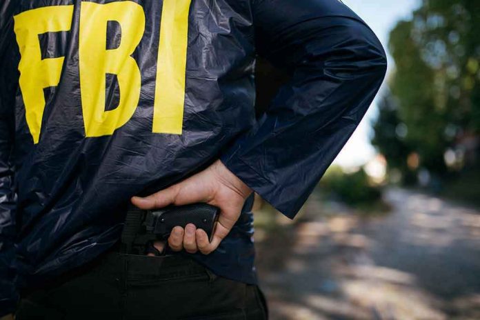 624106589-1 FBI agent holding a gun behind the back.