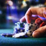 FRAUD Mastermind DRAGGED From CASINO Hand stacking poker chips on casino table