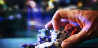 FRAUD Mastermind DRAGGED From CASINO Hand stacking poker chips on casino table