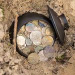 Pot of old coins uncovered in the ground