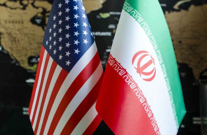 shutterstock_1612173742 Flags of the United States and Iran displayed together