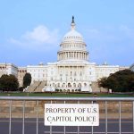 Congress JUST PRIORITIZED SPENDING Abroad Over AMERICA View of the U.S. Capitol building with a security barrier in front