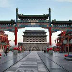 NEW LAW — China Can NOW TARGET ANY Foreign Individual A vibrant traditional Chinese gateway with ornate decorations in an urban setting