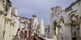 Holy Shrine DESTROYED –Historical TREASURE LOST! Interior view of a destroyed building with collapsed arches and debris