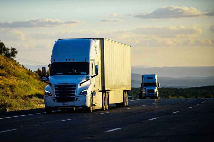 2146415481-1 Two semitrucks driving on a highway