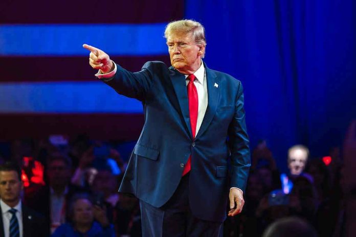 2430065795 Person in suit pointing during a public event.