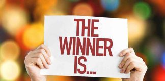 Democrat Titan TOPPLED — Socialist Firebrand SURGES Hands holding a sign reading The Winner Is...