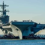 NEW Carriers REVEAL FATAL FLAW! Aircraft carrier guided by tugboats in a harbor