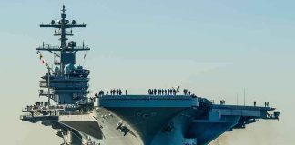 NEW Carriers REVEAL FATAL FLAW! Aircraft carrier guided by tugboats in a harbor