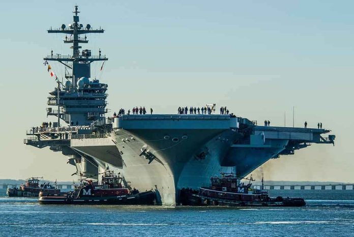 shutterstock_1018972291 Aircraft carrier guided by tugboats in a harbor