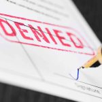 SHOCKING RULING — Judge UPENDS Bathroom Rules — Title IX Twist Fountain pen signing a form marked denied