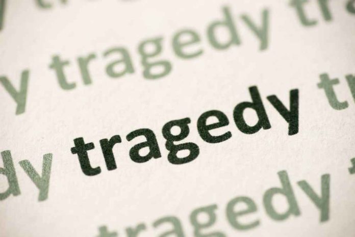 shutterstock_1132311686 Close-up of the word 'tragedy' printed multiple times in varying shades