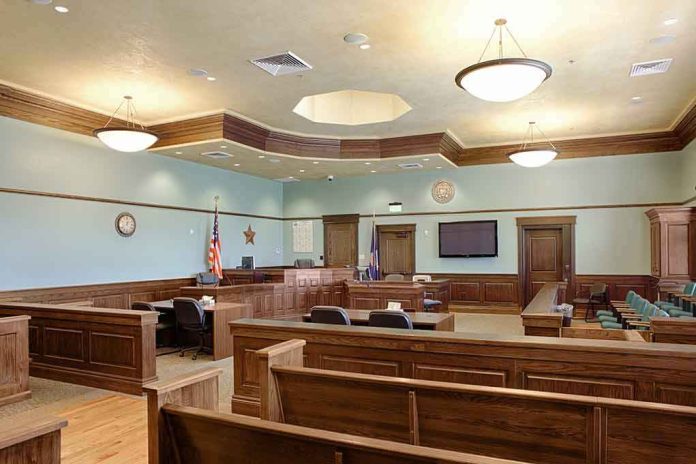 Empty courtroom with wooden benches and judge's bench