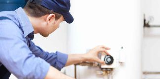 CHILLING — Home Repair Ends In BLOOD Plumber adjusting the settings on a water heater