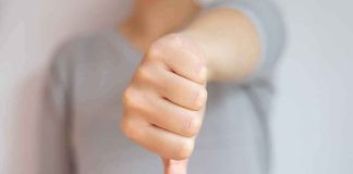 hand showing a thumbs down gesture