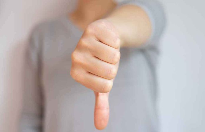 shutterstock_1507690676-1 hand showing a thumbs down gesture