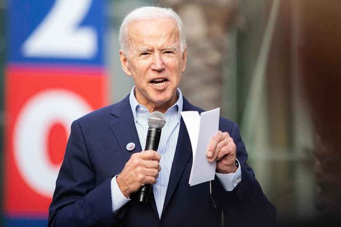 Elderly man speaking into a microphone at an outdoor event