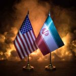 IT’S OVER! — Trump Torches Iran Deal Flags of the United States and Iran displayed on stands with a smoky background