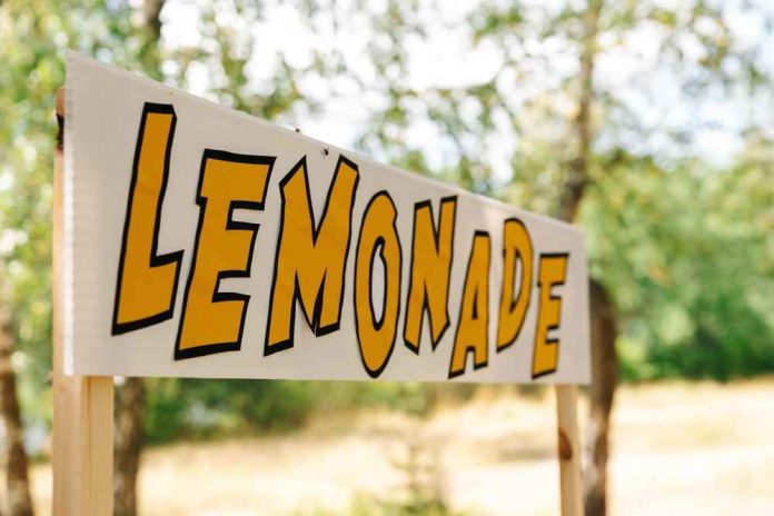 shutterstock_2190907963-1 Lemonade stand sign with bold yellow letters outdoors
