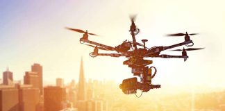 EMBARRASSING — Police Live FEED, Unlocked — For Months A drone flying over a city skyline during sunset